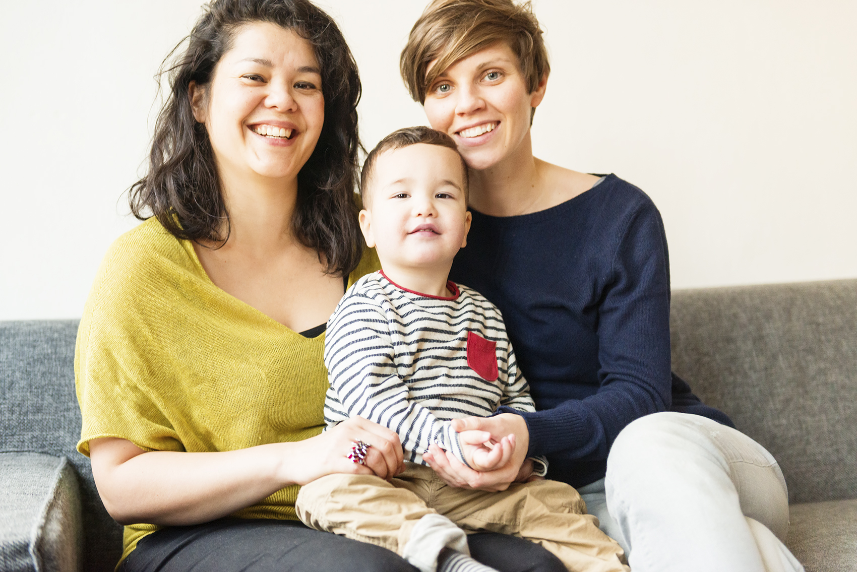 Couple and baby on couch