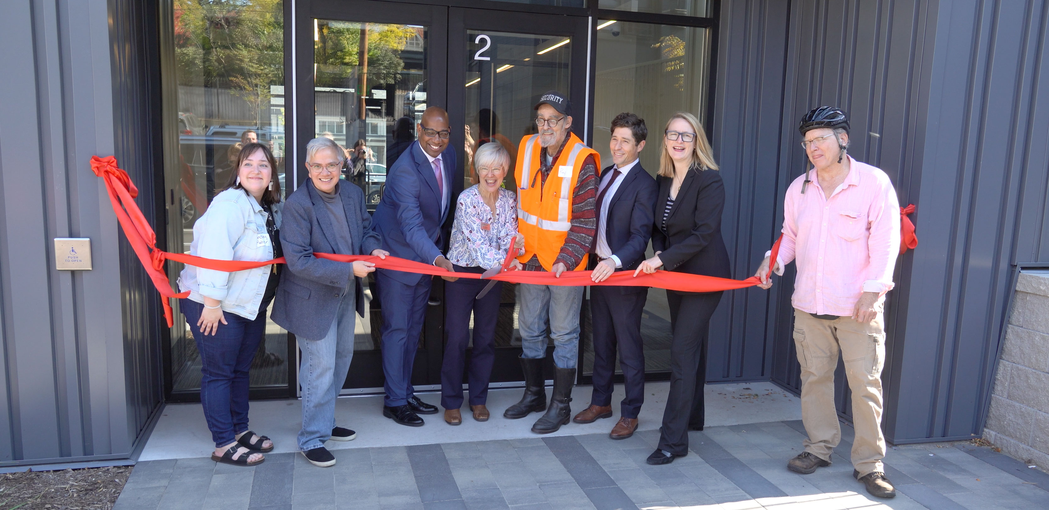People cutting ribbon