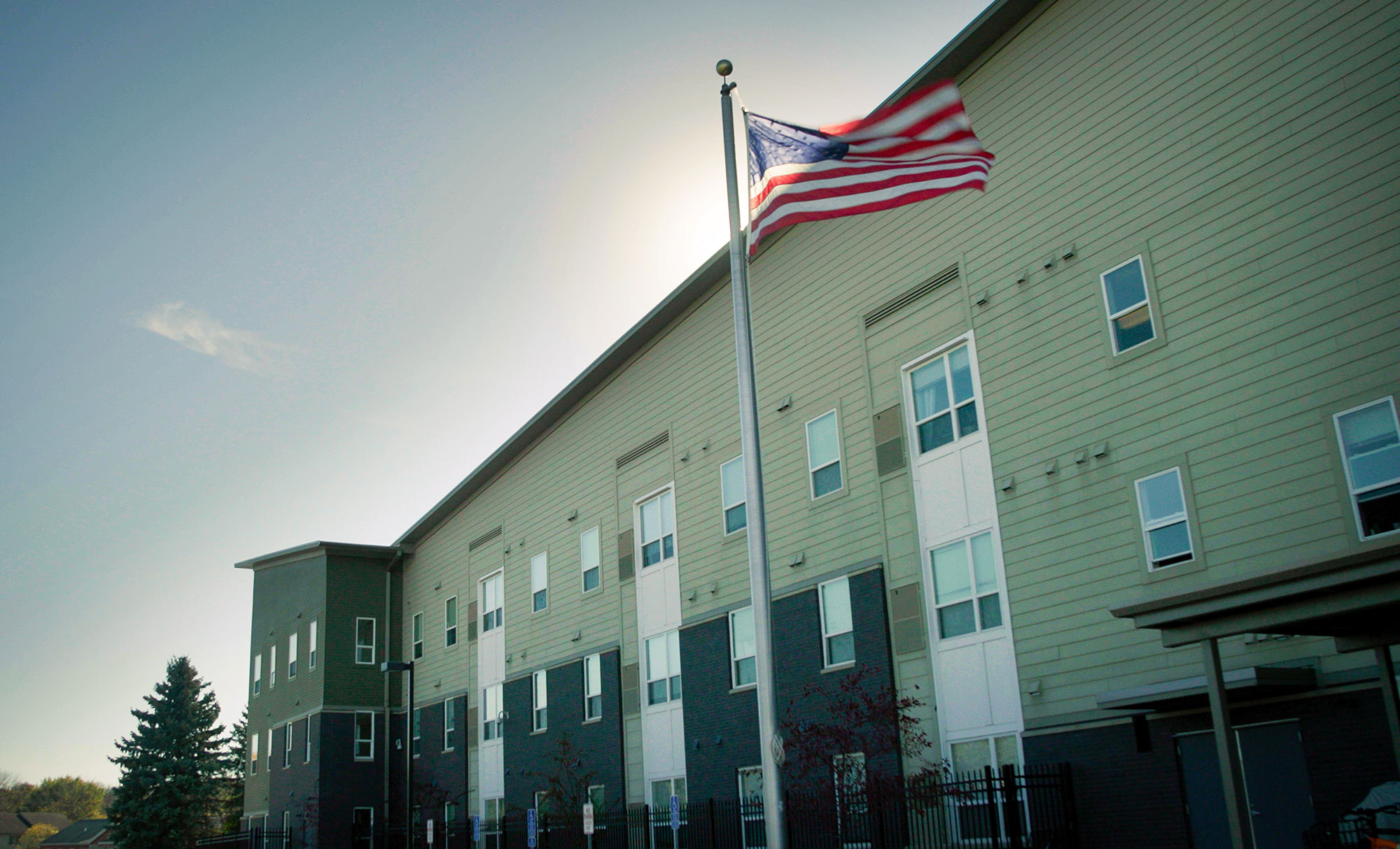 Rental housing exterior and American flag